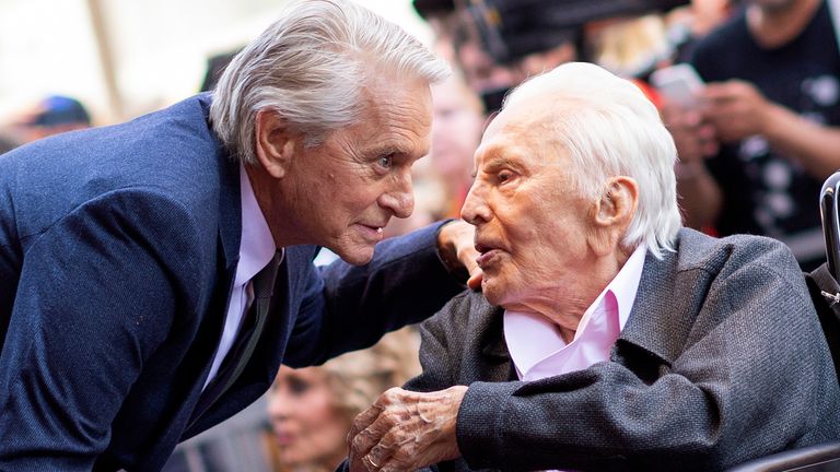 Actor Kirk Douglas (R) attends a ceremony honoring his son actor Michael Douglas (L) with a Star on Hollywood Walk of Fame, in Hollywood, California on November 6, 2018