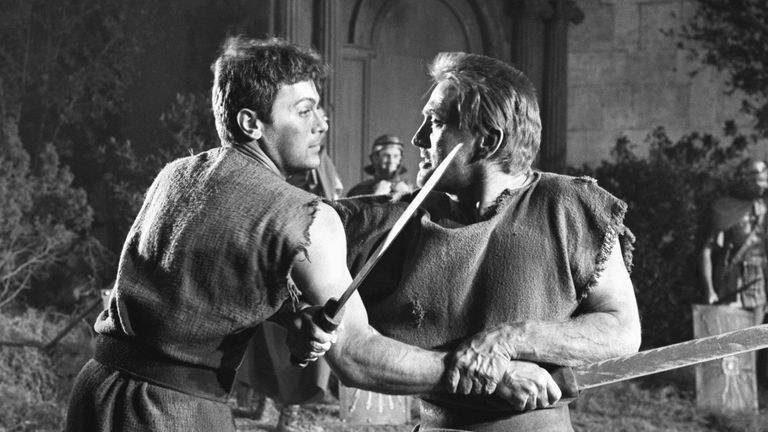 Kirk Douglas (r) in a sword fight scene from Spartacus with Tony Curtis 