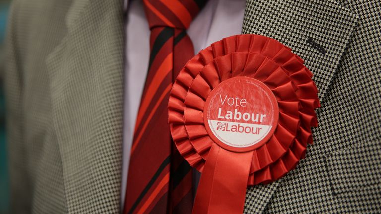 File photo of a man wearing a Labour rosette