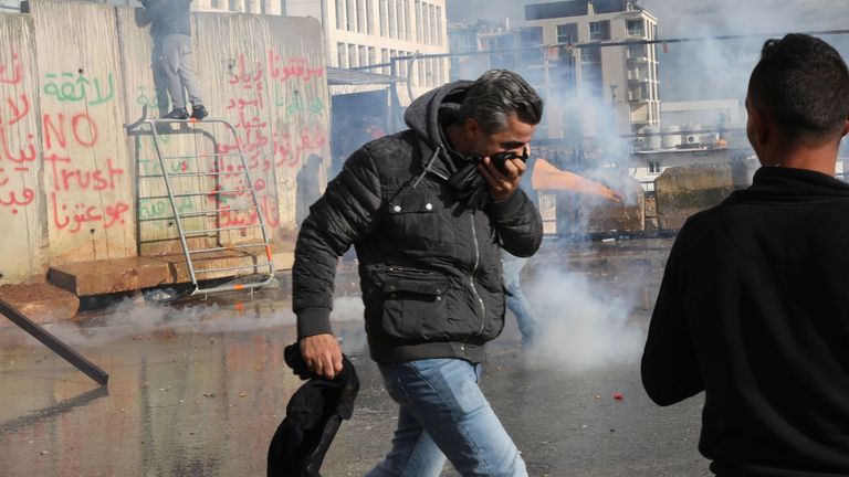 Security forces use tear gas to disperse protesters