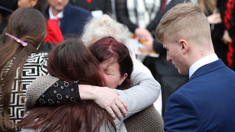 Mourners embraced after the funeral service in Sevenoaks