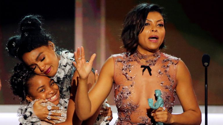 FILE PHOTO: Taraji P. Henson (R) and Janelle Monae accept their award for Cast in a Motion Picture for "Hidden Figures" during the 23rd Screen Actors Guild Awards in Los Angeles, California, U.S., January 29, 2017. REUTERS/Mike Blake/File Photo
