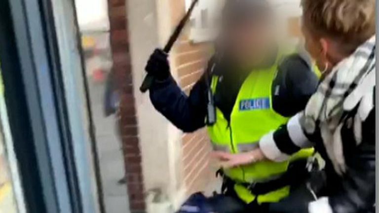 Police have launched an investigation after a 16-year-old football fan was left bloodied by an officer who struck him on the head with a baton.