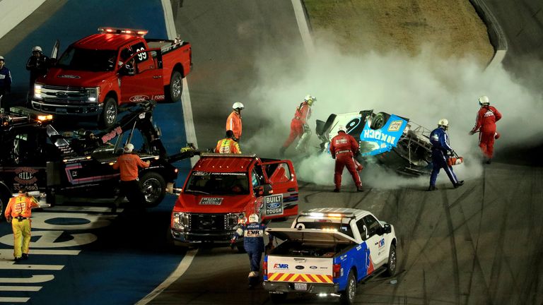 DAYTONA BEACH, FLORIDA - FEBRUARY 17: Safety crews respond to a wreck involving Ryan Newman, driver of the #6 Koch Industries Ford, after the NASCAR Cup Series 62nd Annual Daytona 500 at Daytona International Speedway on February 17, 2020 in Daytona Beach, Florida. (Photo by Mike Ehrmann/Getty Images)
