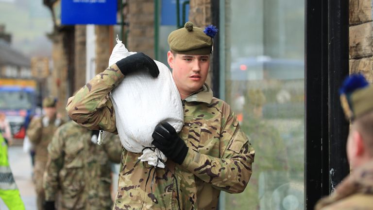 Soldiers from The Highlanders, 4th Battalion, the Royal Regiment of Scotland in Mytholmroyd assisting with flood defences, in the Upper Calder Valley in West Yorkshire, as the UK is braced for widespread weather disruption for the second weekend in a row as Storm Dennis sweeps in.
