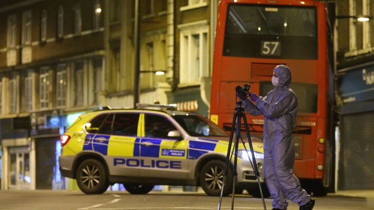 A police forensic officer works on Streatham High Road in south London on February 2, 2020, after a man is shot dead by police following reports of people being stabbed in the street. - British police on Sunday said they had shot a man in south London, after at least two people were stabbed in a suspected "terrorist-related" incident. (Photo by ISABEL INFANTES / AFP) (Photo by ISABEL INFANTES/AFP via Getty Images)
