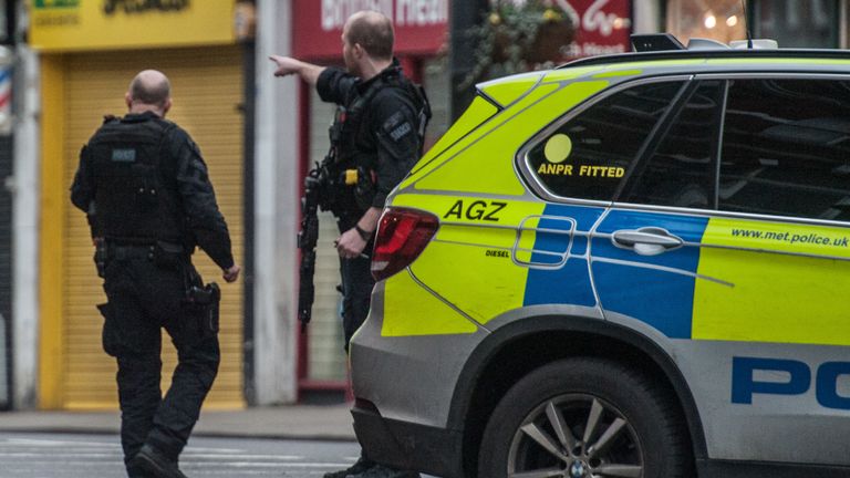 LONDON, ENGLAND - FEBRUARY 2: Armed Police stand guard near the scene of the shooting after a man was shot and killed by armed police on February 2, 2020 in London, England. The Metropolitan police have said that a number of people had been stabbed during a terrorist-related incident in Streatham. (Photo by Guy Smallman/ Getty Images)