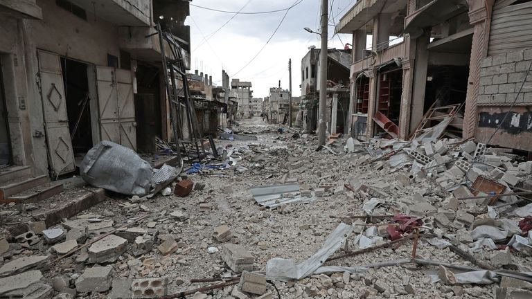 Debris fills the streets of Sarmin, a town close to Idlib in northwestern Syria