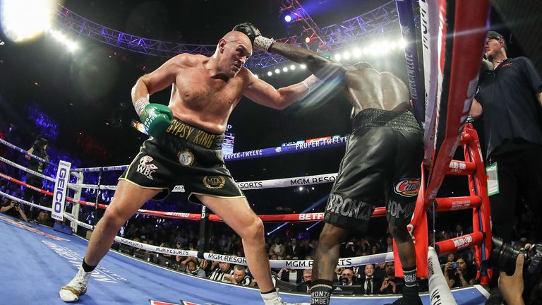 LAS VEGAS, NEVADA - FEBRUARY 22: Tyson Fury (R) punches Deontay Wilder during their Heavyweight bout for Wilder's WBC and Fury's lineal heavyweight title on February 22, 2020 at MGM Grand Garden Arena in Las Vegas, Nevada. (Photo by Al Bello/Getty Images) 