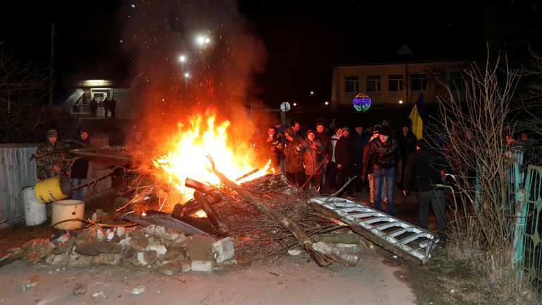 The protesters started fires and erected a barricade in the road