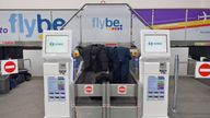 Jackets and coats left at theFlybe check-in desks at Birmingham International Airport as Flybe, Europe&#39;s biggest regional airline, has collapsed into administration. PA Photo. Picture date: Thursday March 5, 2020. See PA story AIR FlyBe. Photo credit should read: Jacob King/PA Wire