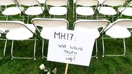 Family members of victims of the MH17 crash lined up empty chairs for each seat on the plane outside the Russian Embassy in The Hague