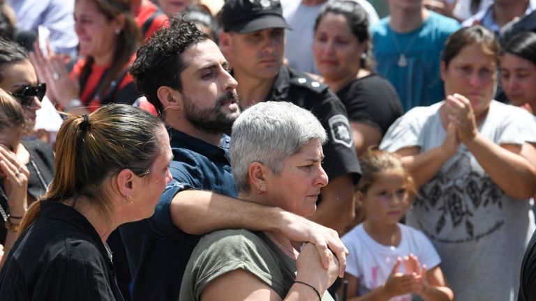 PROGRESO, ARGENTINA - FEBRUARY 16: Carina Mercedes Taffarel (C) mother of Emiliano Sala looks at the coffin after a vigil as she is comforted by relatives at Sala's boyhood club San Martin de Progreso on February 16, 2019 in Progreso, Argentina. 28-year-old striker was killed when the private plane carrying him from Nantes to Cardiff crashed in the English Channel near Alderney on January 21. Sala's body was recovered from the wreckage on February 6 and pilot David Ibbotson remains missing. (Photo by Gustavo Garello/Getty Images)