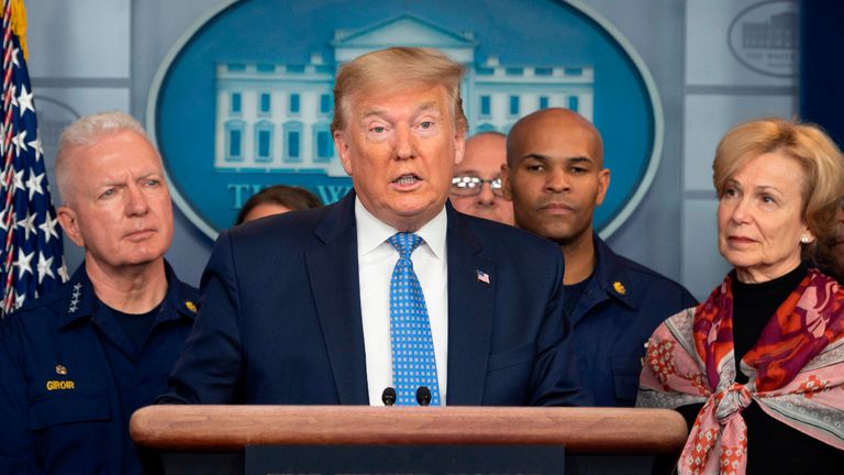 US President Donald Trump standing with members of the White House Coronavirus Task Force team, speaks during a press briefing in the press briefing room of the White House March 15, 2020 in Washington, DC. (Photo by JIM WATSON / AFP) (Photo by JIM WATSON/AFP via Getty Images)