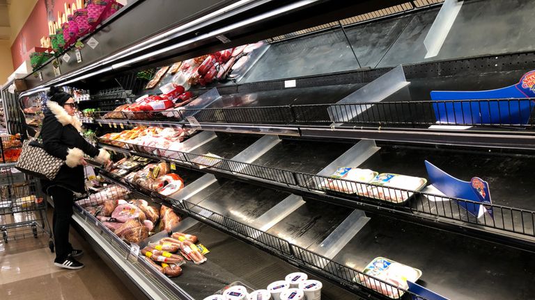 Meat shelves lay empty at a supermarket in Saugus, Massachusetts on March 13, 2020. - Supermarkets and shops around Boston have been emptied by customers in fear of Covid-19. (Photo by Joseph Prezioso / AFP) (Photo by JOSEPH PREZIOSO/AFP via Getty Images)