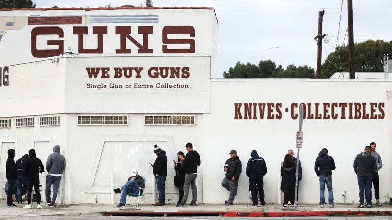 CULVER CITY, CALIFORNIA - MARCH 15: People stand in line outside the Martin B. Retting, Inc. guns store on March 15, 2020 in Culver City, California. The spread of Coronavirus (COVID-19) has prompted some Americans to line up for supplies in a variety of stores. (Photo by Mario Tama/Getty Images)