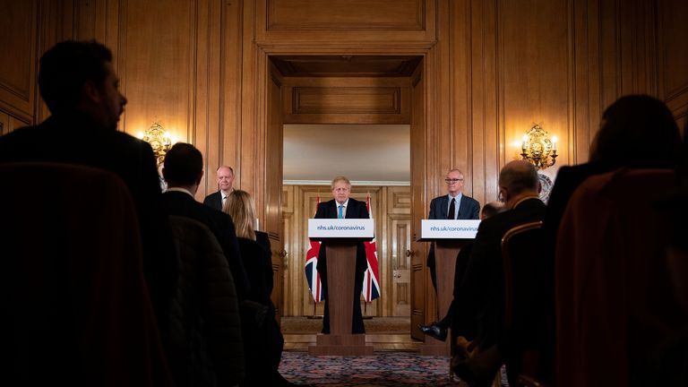 Chief Medical Officer Chris Whitty (L) and Chief Scientific Adviser Patrick Vallance (R) look on as Britain's Prime Minister Boris Johnson addresses a news conference to give a daily update on the government's response to the novel coronavirus COVID-19 outbreak, inside 10 Downing Street in London on March 19, 2020. (Photo by Leon Neal / POOL / Getty Images) (Photo by LEON NEAL/POOL/AFP via Getty Images)