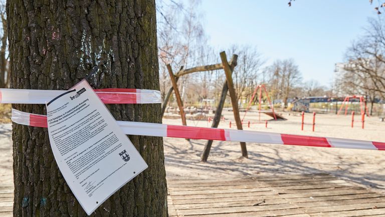 BERLIN, GERMANY - MARCH 23: An official paper informs parents not to use the playground in Berlin Kreuzberg due to the new contact restrictions because of covid-19 on March 23rd in BERLIN, Germany. The coronavirus and the disease it causes, covid-19, are having a fundamental impact on society, government and the economy in Germany. Public life has been restricted to the essentials in an effort by authorities to slow the spread of infections. Hospitals are scrambling to increase their testing and care capacity. An economic recession seems likely as economic activity is slowed and many businesses are temporarily closed. Schools, daycare centers and universities remain shuttered. And government, both federal and state, seek to mobilize resources and find adequate policies to confront the virus and mitigate its impact. (Photo by Sebastian Reuter/Getty Images)