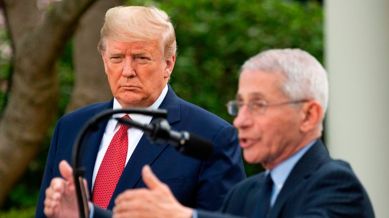 US President Donald Trump listens as Director of the National Institute of Allergy and Infectious Diseases Dr. Anthony Fauci speaks during a Coronavirus Task Force press briefing in the Rose Garden of the White House in Washington, DC, on March 29, 2020. (Photo by JIM WATSON / AFP) (Photo by JIM WATSON/AFP via Getty Images)