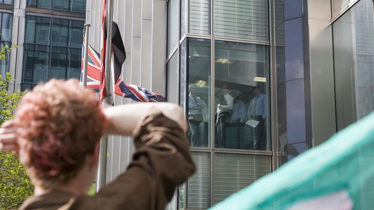 Climate change protesters have held demonstrations outside Barclays&#39; Canary Wharf headquarters