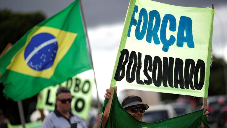 Supporters of far-right Brazilian President Jair Bolsonaro protest against the recommendations for social isolation in Brasilia, Brazil