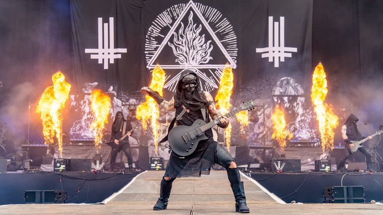 CASTLE DONINGTON, ENGLAND - JUNE 15: Adam Darski of Behemoth performs on stage during Download festival 2019 at Donington Park on June 14, 2019 in Castle Donington, England. (Photo by Joseph Okpako/WireImage)