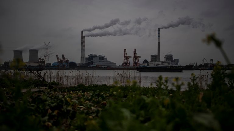 The Huangpu river and the Wujing Coal-Electricity Power Station in Shanghai are pictured on February 21, 2017