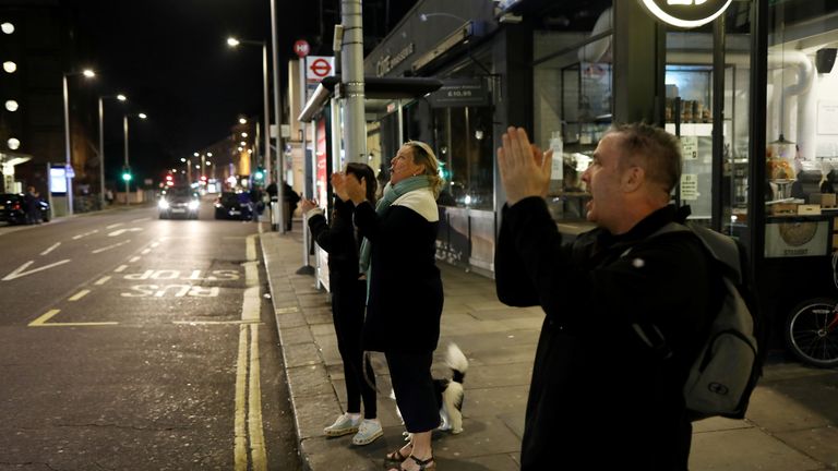 People on the streets outside Chelsea and Westminster Hospital applaud NHS workers during the Clap for our carers campaign in support of the NHS, as the spread of the coronavirus disease (COVID-19) continues, London, Britain, March 26, 2020