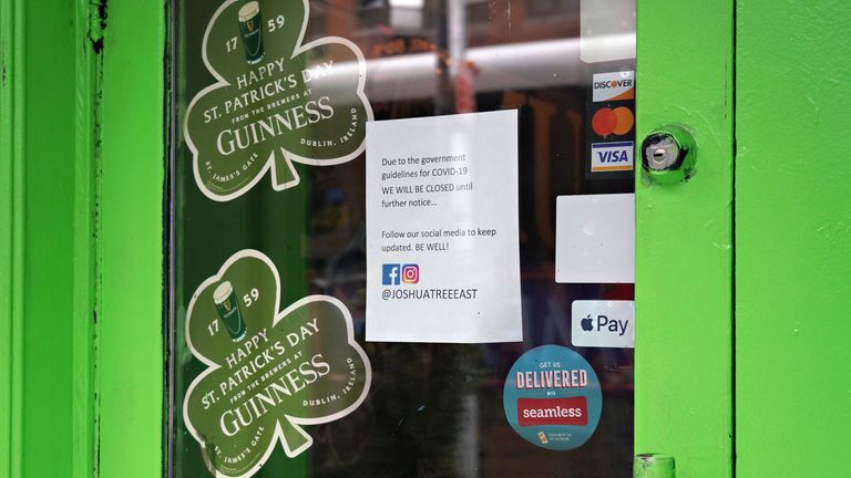 NEW YORK, NY - MARCH 16: A closure sign is posed alongside Happy St. Patricks Day decorations in the window of Joshua Tree Bar as the coronavirus continues to spread across the United States on March 16, 2020 in New York City. The World Health Organization declared coronavirus (COVID-19) a global pandemic on March 11th. (Photo by Cindy Ord/Getty Images)