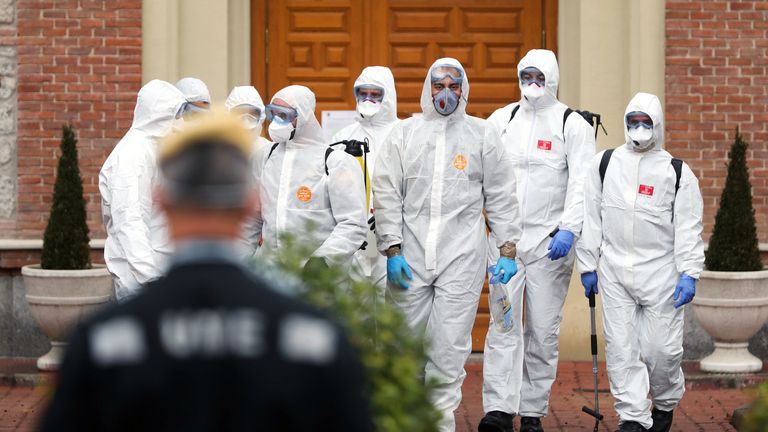 Members of the Military Emergency Unit leave an elderly home in Madrid after carrying out disinfection procedures 