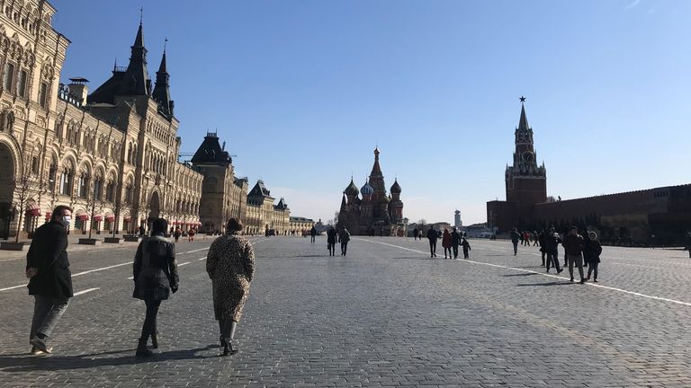 Moscow&#39;s Red Square looks relatively empty but people are still out enjoying the sunshine