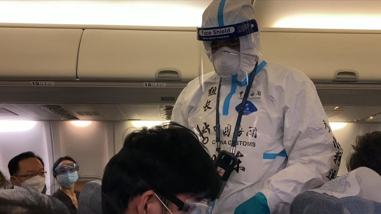 On board, all the Air China cabin crew were in full protective gear