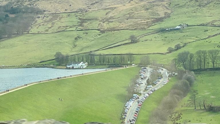 Cars are seen lining up in Dovestone Reservoir, Greater Manchester