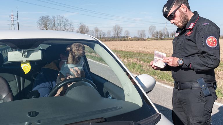 Military police check documents at a &#39;red zone&#39; checkpoint in San Fiorano, southeast of Milan