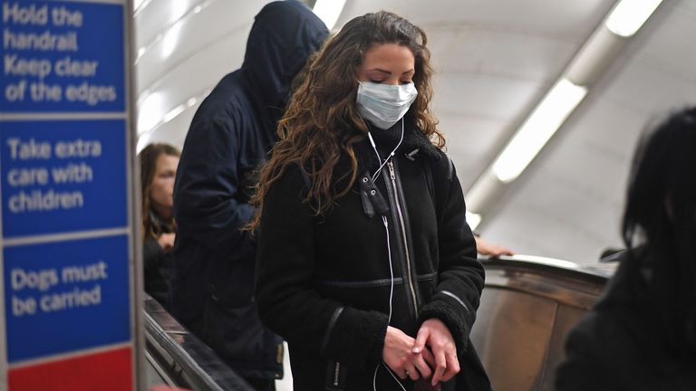 A woman at Green Park station on the London Underground tube network wearing a protective facemask. PA Photo. Picture date: Wednesday March 4, 2020. See PA story HEALTH Coronavirus . Photo credit should read: Kirsty O&#39;Connor/PA Wire