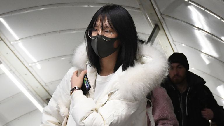 A women wearing a face mask at Leicester Square tube station, London