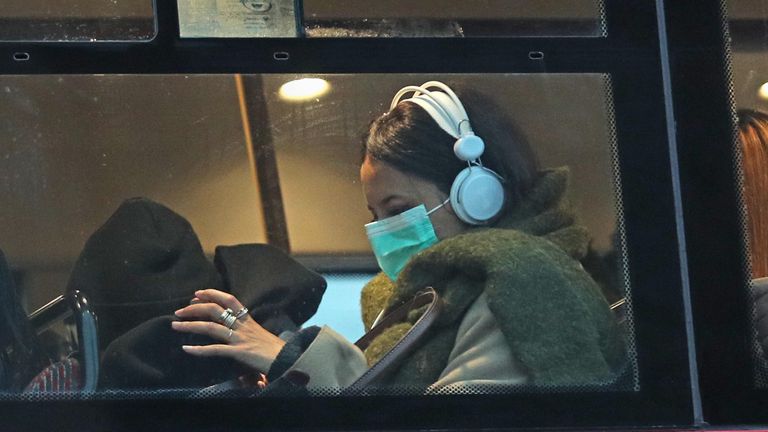 A woman wearing a face mask on a bus in London, as the first case of coronavirus has been confirmed in Wales and two more were identified in England - bringing the total number in the UK to 19. PA Photo. Picture date: Friday February 28, 2020. See PA story HEALTH Coronavirus. Photo credit should read: Yui Mok/PA Wire       