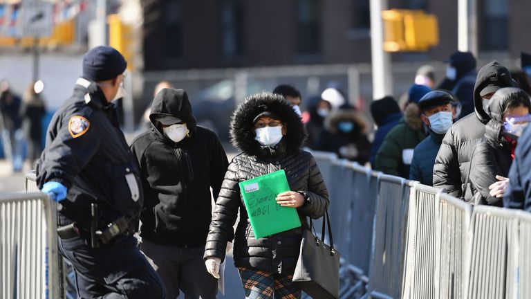 People queue for coronavirus testing in Queens, New York