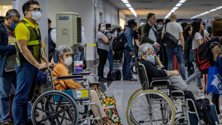 MANILA, PHILIPPINES - MARCH 10: Elderly travelers are seen wearing facemasks as they queue at an immigration counter upon arrival at Ninoy Aquino International Airport on March 10, 2020 in Manila, Philippines. Philippine President Rodrigo Duterte on Monday declared a state of public health emergency as the number of people infected with COVID-19 in the country rose to 33 from just 3 cases last week. With over 115,000 confirmed cases around the world, the coronavirus has so far claimed over 4,000 lives. (Photo by Ezra Acayan/Getty Images)