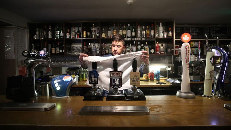 Bar Manager Lee at The White Hart Pub in Ironbridge, Shropshire closes the bar at the final bell