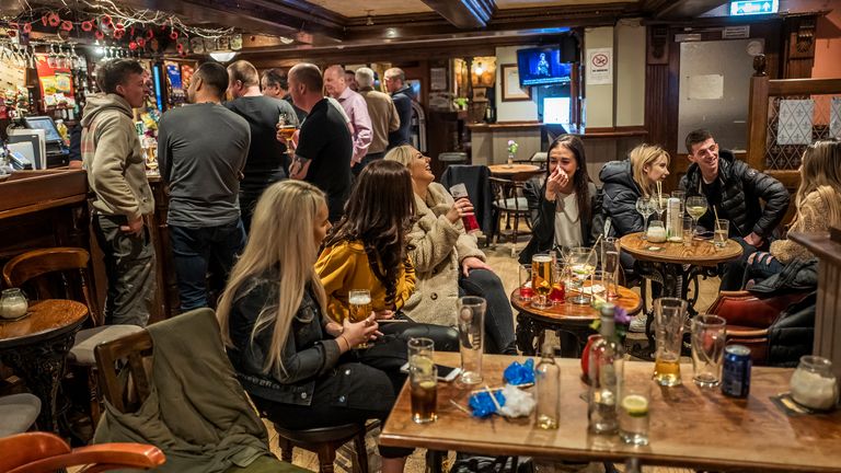 Patrons enjoy a last drink at closing time at The White House pub in Stalybridge
