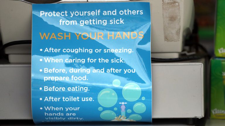 A sign displayed at a mobile pharmacy at Cheltenham racecourse referencing how to protect yourself and others from getting sick following the Coronavirus outbreak ahead of day one of the Cheltenham Festival at Cheltenham Racecourse, Cheltenham.