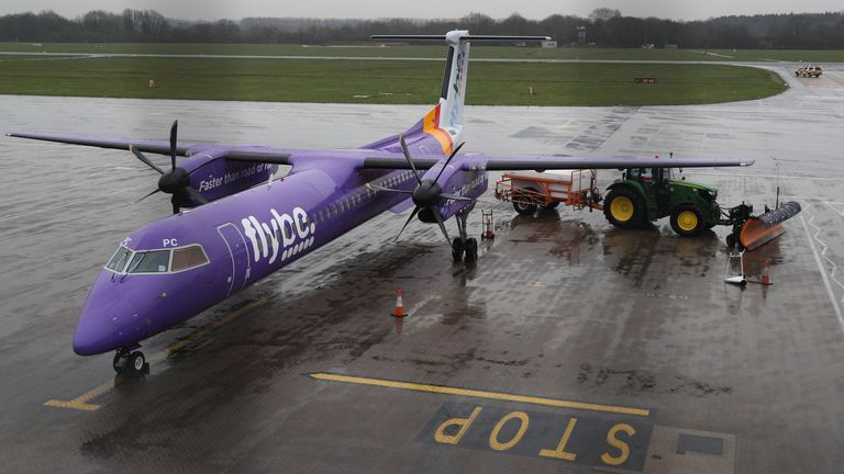 A tractor blocks the wing of a Flybe plane at Southampton Airport as Flybe, Europe&#39;s biggest regional airline, has collapsed into administration. PA Photo. Picture date: Thursday March 5, 2020. See PA story AIR FlyBe. Photo credit should read: Andrew Matthews/PA Wire