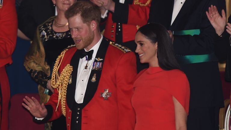 Harry and Meghan held hands as they were welcomed to the festival