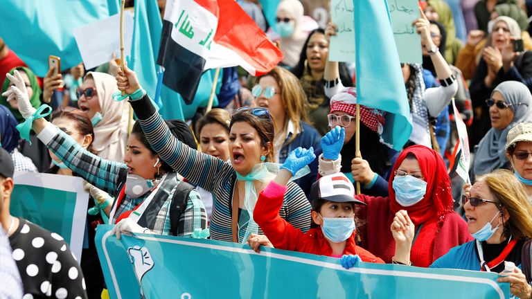 Women marched in Iraq while wearing protective face masks