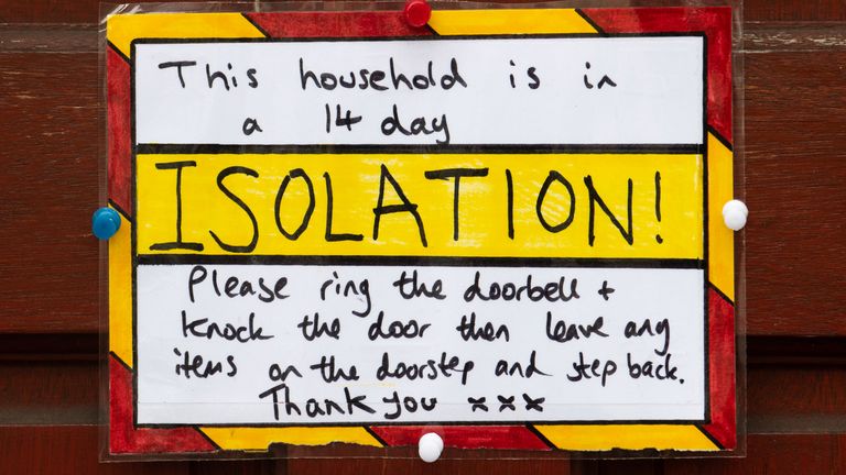 A sign on the front door of a house in self-isolation in Cardiff