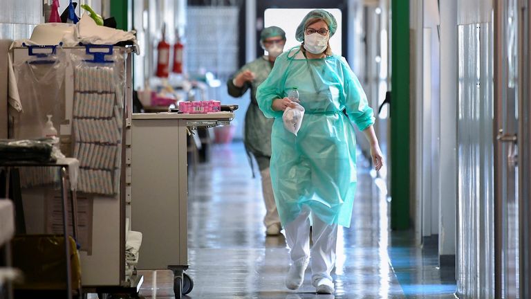 Medical workers wearing protective masks and suits at a hopsital in Cremona, Italy