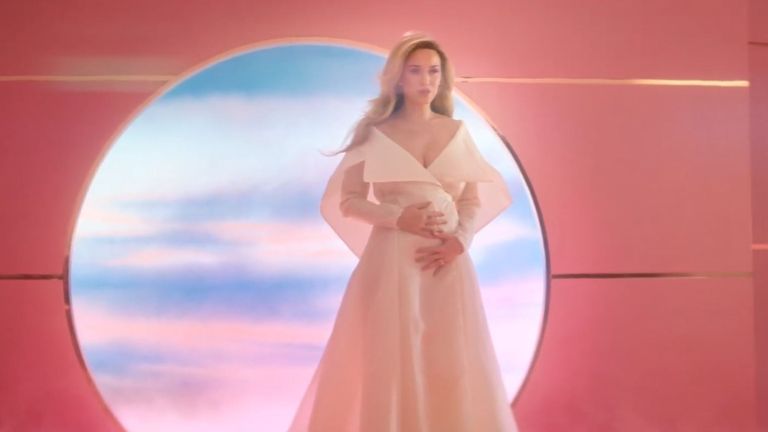 Katy Perry places her hands on her baby bump during her new music video. Pic: Capitol Records