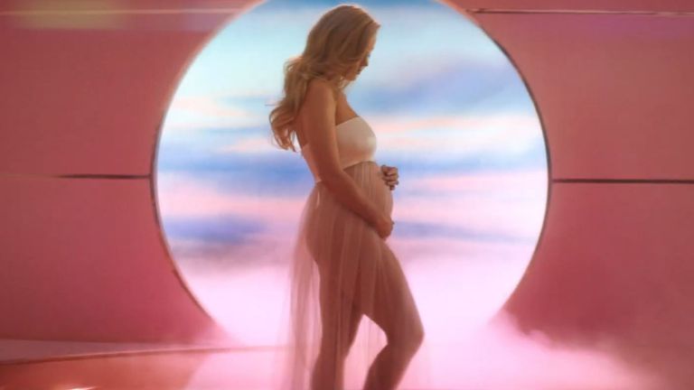 Katy Perry cradling her baby bump at the end of the music video for her new single, Never Worn White. Pic: Capitol Records