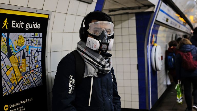 A person wearing a full face mask in King&#39;s Cross underground station in London after NHS England announced that the coronavirus death toll had reached 104 in the UK. PA Photo. Picture date: Wednesday March 18, 2020. See PA story HEALTH Coronavirus. Photo credit should read: Ian Hinchliffe/PA Wire